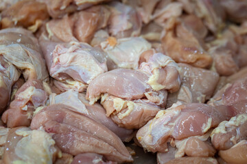 Raw fresh meat of chicken (chicken breast) selling on local market stall. Raw food and cooking ingredient photo.