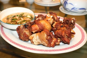 Fried chicken thighs with a spicy soysauce vinegar dipping