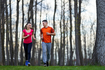Young couple running in the park