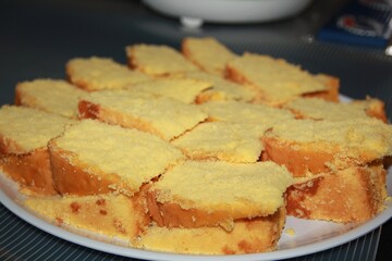 Slices of chiffon cake piled in a white round plate