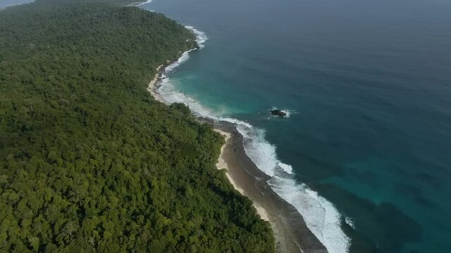 Wild islands of Indonesia. Sumatra. tropical paradise. Telos, Banyak, Mentawai. drone shooting. Wild beaches, blue lagoons, coral reefs, green hills. aerial view. High quality 4k footage