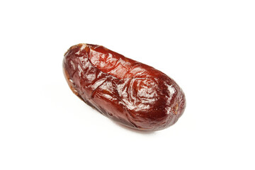 Single date fruit isolated on white background. Shiny dry arabian food