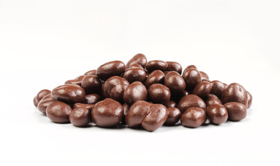 Group of chocolate covered raisins isolated on white background. Delicious sweet dragee