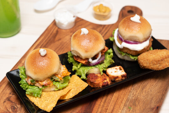 High-angle shot of three chicken miniburgers