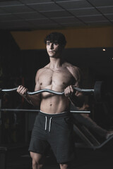 Fototapeta na wymiar young athlete training in a gym