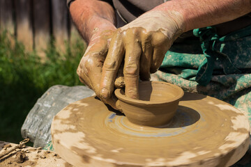 hands of a potter at work