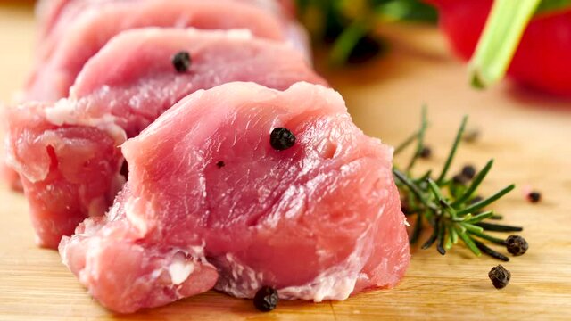 raw filet mignon on wooden board
