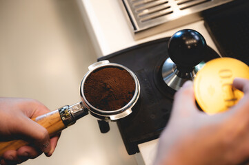 espresso coffee machine in cafe, professional barista making a hot drink caffeine with a cup on the bar in a shop or restaurant, modern coffee shop, brown cappuccino beverage maker