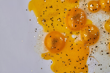 Naklejka na ściany i meble Close up yellow yolks on white background.