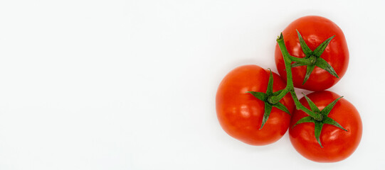 fresh young early tomatoes isolated on a white background with a blank space for your text