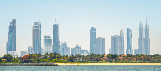 Obraz premium Dubai Marina skyscrapers and villas on the Palm Jumeirah. Luxury properties of UAE