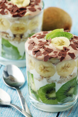 Trifle desserts with bananas, kiwi and yogurt