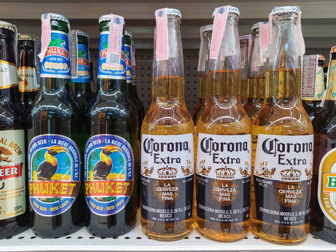 Corona extra beer and Puket beer in supermarket at Chiang Mai - THAILAND, April 20, 2021