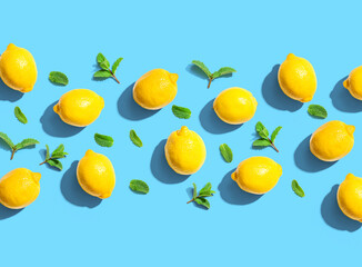 Fresh yellow lemons with mints overhead view