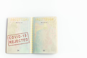 Concept representing a vaccination passport with a stamp indicating that the passenger has been rejected because he doesn't have the vaccine requirements