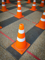  Traffic plastic cones are used instead of standing in order to society distance. - 430177686