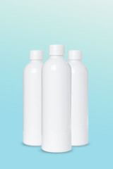 empty white plastic bottles for cosmetics on blue background. Mockup