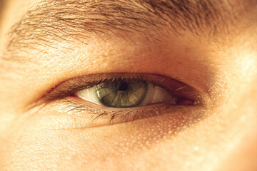 European guy's eye close up. part of the face macro. the eyeball is extremely close. Human pupil