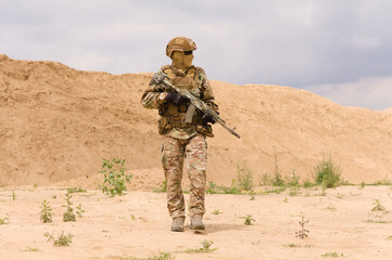 Equipped and armed special forces soldier during military operation