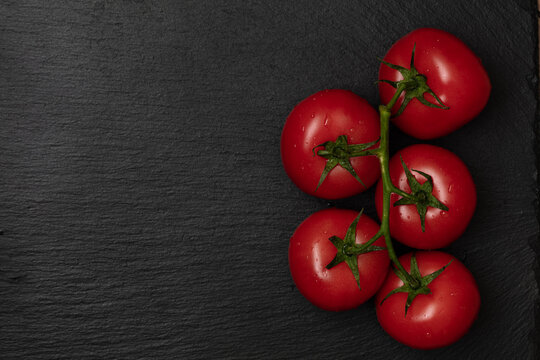 red tomatos on branch