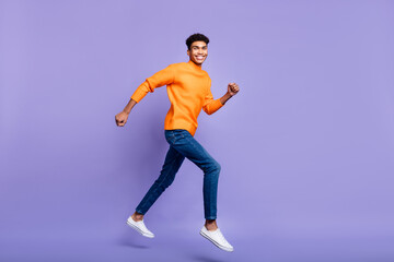 Fototapeta na wymiar Full length body size photo of guy wearing casual outfit jumping up running on sale isolated pastel purple color background