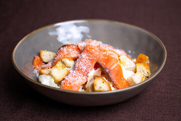 fish salad with salmon and breadcrumbs in a plate