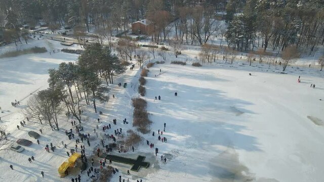 Feast of the Epiphany. People bathe in cold water. Aerial view.