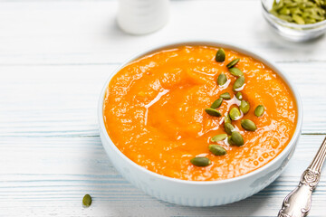 Pumpkin sweet potato soup in a bowl.Space for text.