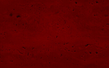 natural red travertine stone texture background. travertine marble tile with rough surface. Wall of travertine with stone layers of different red colors. close up architecture tile background.