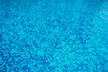 Abstract pool water.  Swimming pool flow with waves background surface of blue swimming pool
