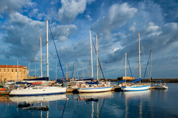 Fototapeta na wymiar Yachts and boats in picturesque old port of Chania, Crete island. Greece