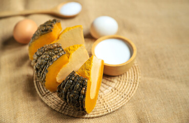 Stream pumpkin custard with coconuy milk and eggs on sack for eating in freetime