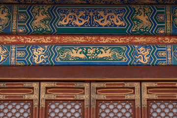The ancient buildings with red wall, yellow or gray tile roof, door gate in the Forbidden City, Beijing, China