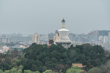 Overlooking the city skyline and white tower in Beihai Park in Beijing, China