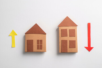 Fototapeta na wymiar 3d paper houses with yellow and red arrows on white background