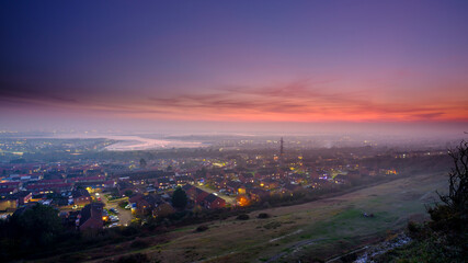 Night view over Portsea Island and Portsmouth Harbour from Portsdown Hill, Hampshire, UK - obrazy, fototapety, plakaty