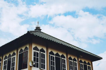 the roof of the mosque against a blue sky as a background