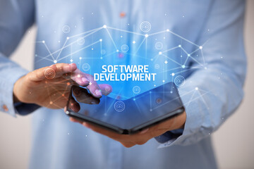 Businessman holding a foldable smartphone, new technology concept