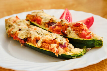Stuffed zucchini on white plate
