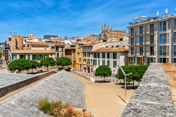 Small urban park and old houses in Palma,