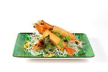 Deep-Fried Vietnamese Shrimps spring rolls with crispy fried noodles on white background....
