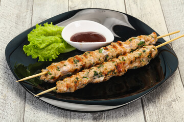 Minced pork skewer kebab with sauce