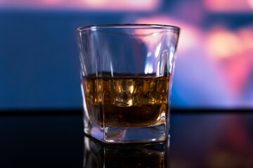 Glass of alcoholic drink with ice