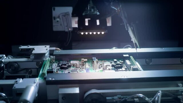 Printed circuit board without electronic components ready for assembly. Technological process. Needle automatic equipment diagnose and test chips and processors. Installation of SMD components