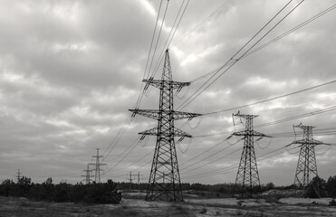  high-voltage  power lines at storm clouds.