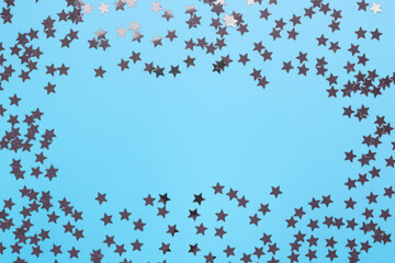 confetti frame in the form of stars on a blue background