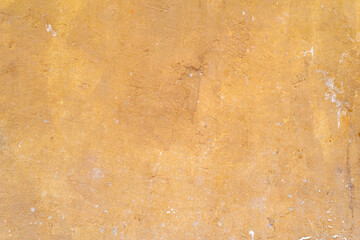 Yellow-orange concrete wall texture. Rough stone texture. Stone background