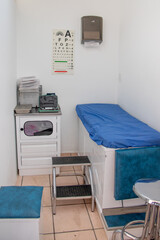 simple doctor's office with auscultation bed, lamp and visual health