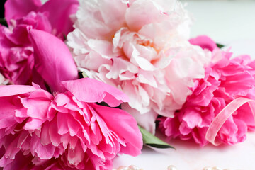 Fototapeta premium romantic composition. bouquet of pink peonies on a white background 