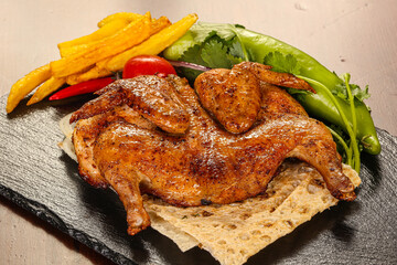 Roasted chicken served various vegetables